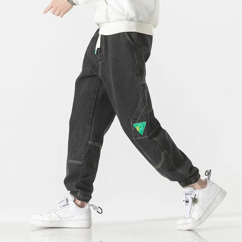 Men's loose-fit tapered trousers in black, available in sizes M through 8XL