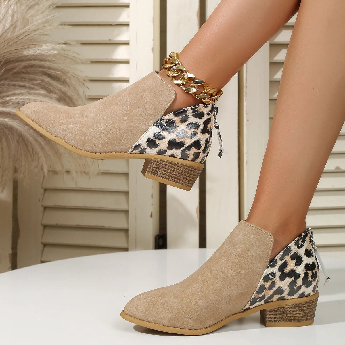 Leopard print women's boots with pointed toe, chunky heel, and back zipper in beige suede