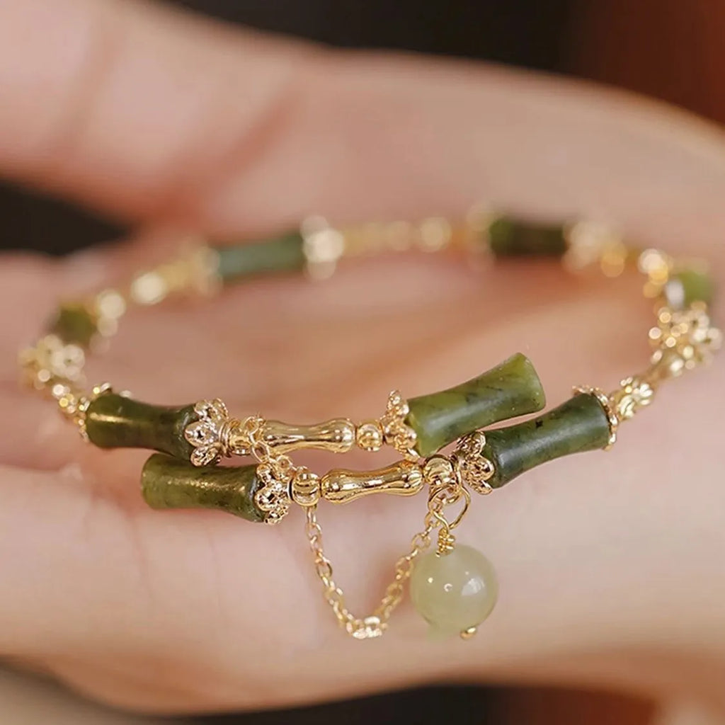 Women's bamboo bead bracelet with coloured glaze detailing in plum wine colour C208