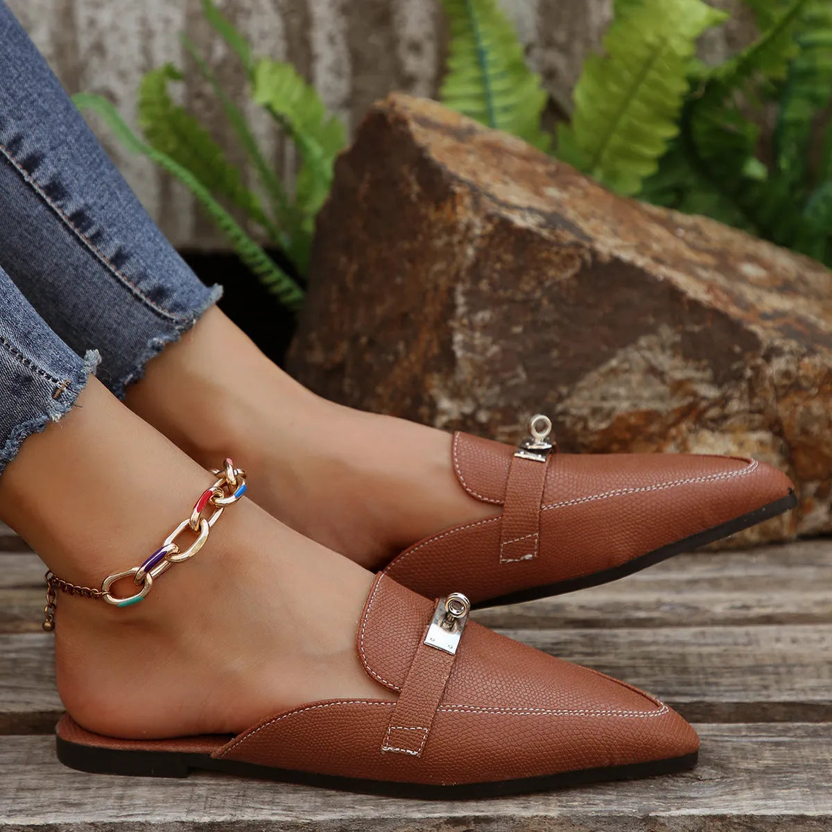 Light brown women's pointed-toe casual slip-on shoes with a low heel and rubber sole.