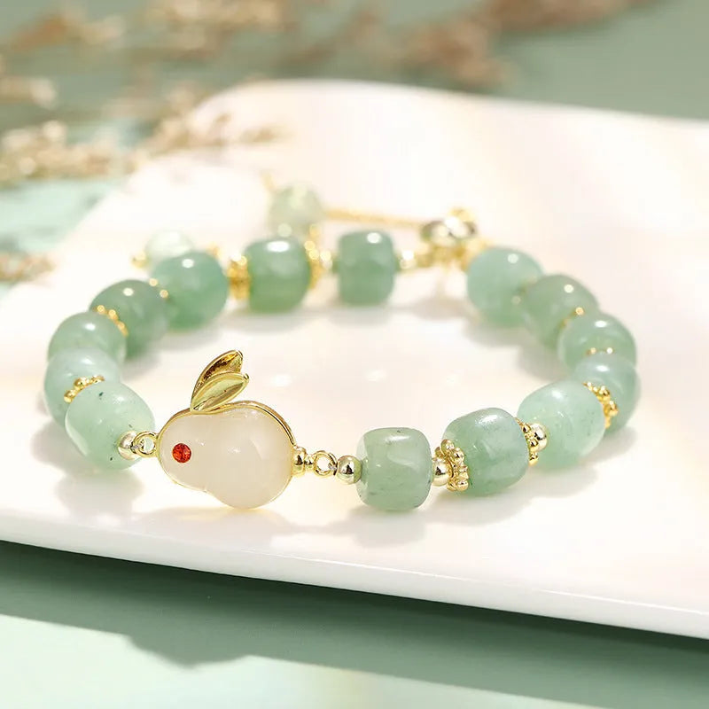 Natural stone rabbit bracelet with green aventurine and strawberry quartz beads, copper plating and gold accents