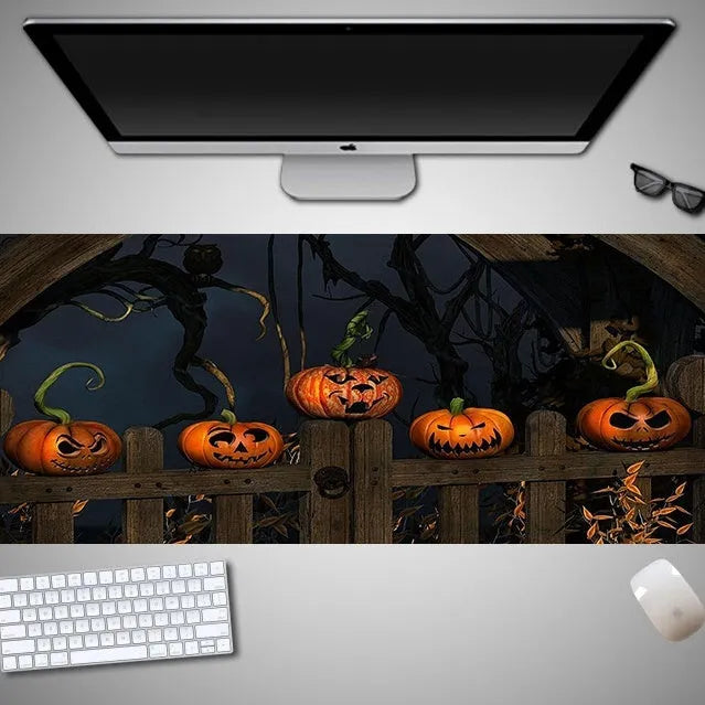 Oversized Halloween-themed mouse pad with non-slip rubber cloth base on a desk
