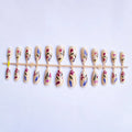 Almond-shaped removable false nails with rose and tulip floral designs on a solid colour background.