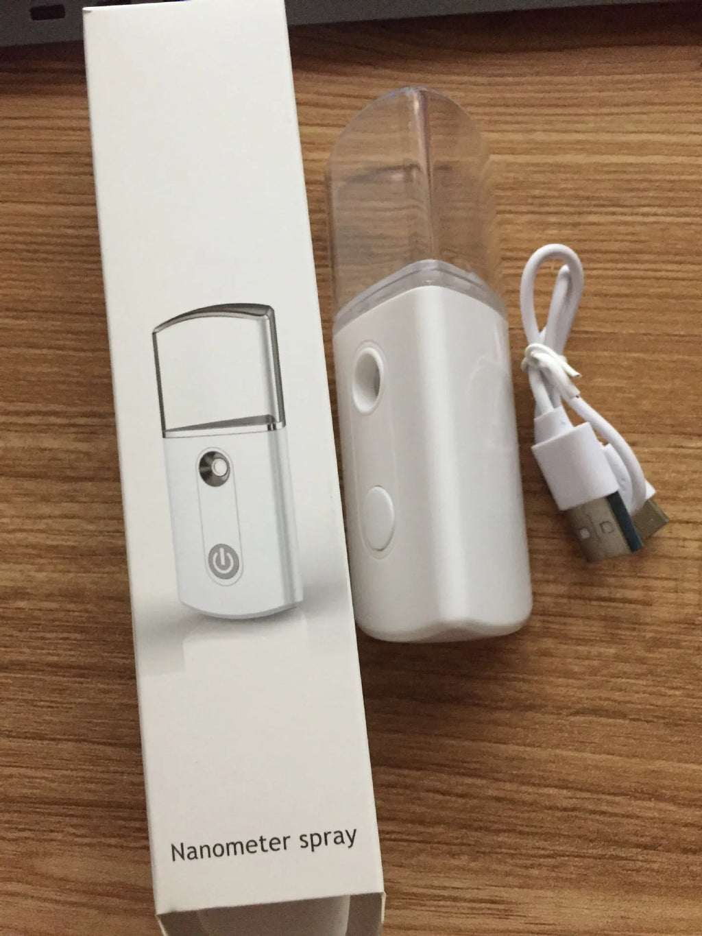 Portable facial nano mist humidifier in white with 20ml tank and compact 10cm body