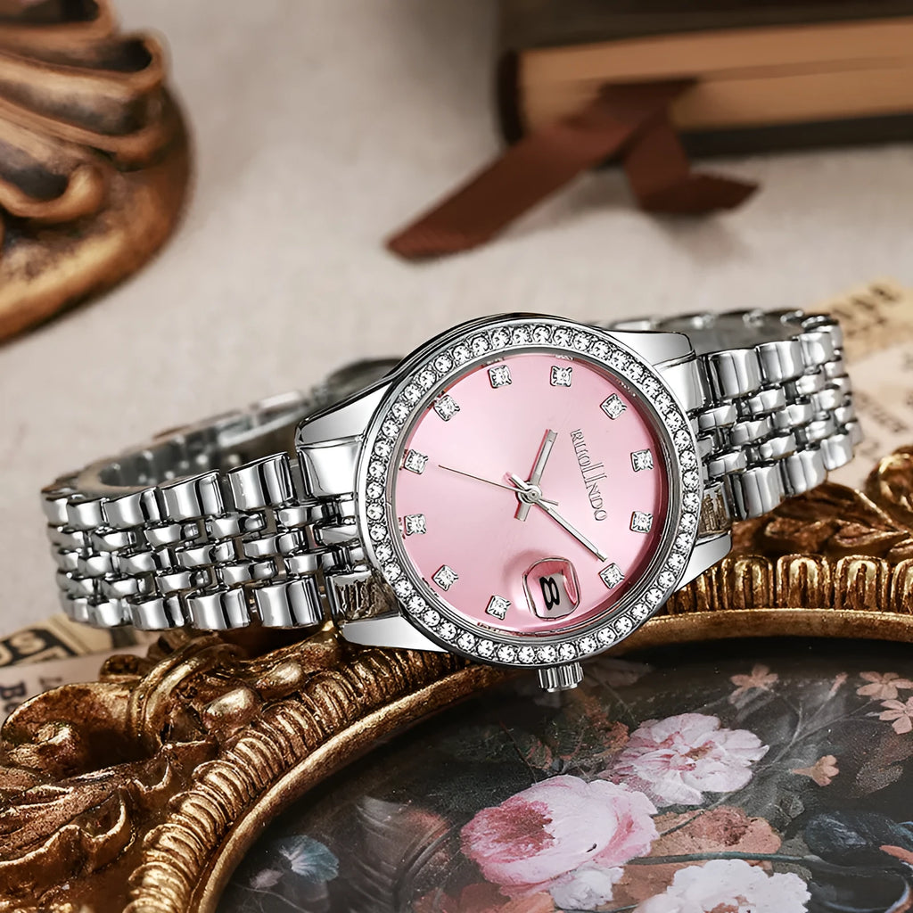 Women's silver alloy calendar watch with circular dial and stainless steel buckle on a wrist.