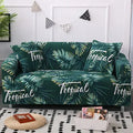 Geometric print stretch sofa slipcover fitted on a grey three-seater sofa.