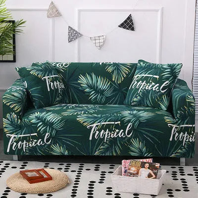 Geometric print stretch sofa slipcover fitted on a grey three-seater sofa.