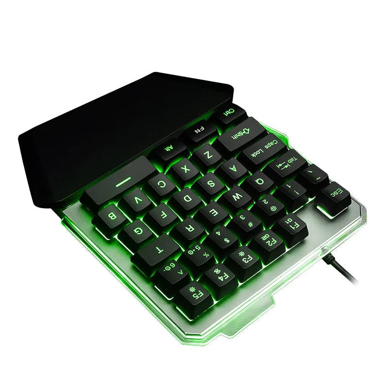 G40 black one-handed mechanical keyboard with RGB backlit keys on a desk.