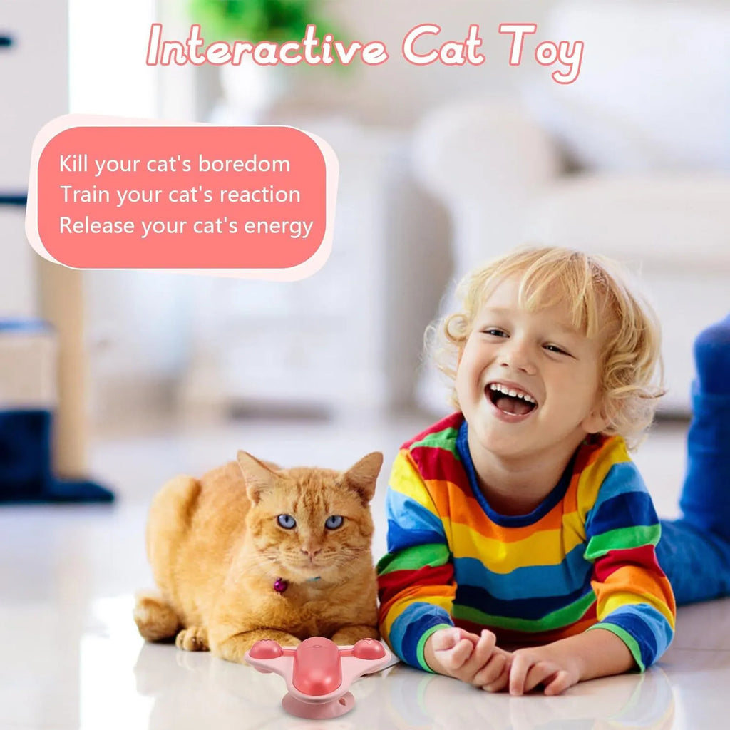 Interactive pet puzzle toy with blue snack cabin, bell, and catnip pouch attached with suction cups.