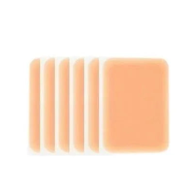 Tattoo cover patch concealer brush makeup tool in assorted skin tone colours.