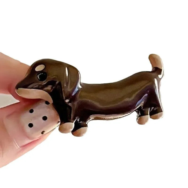 Cute dachshund dog design hair barrettes with an electroplated metallic finish.