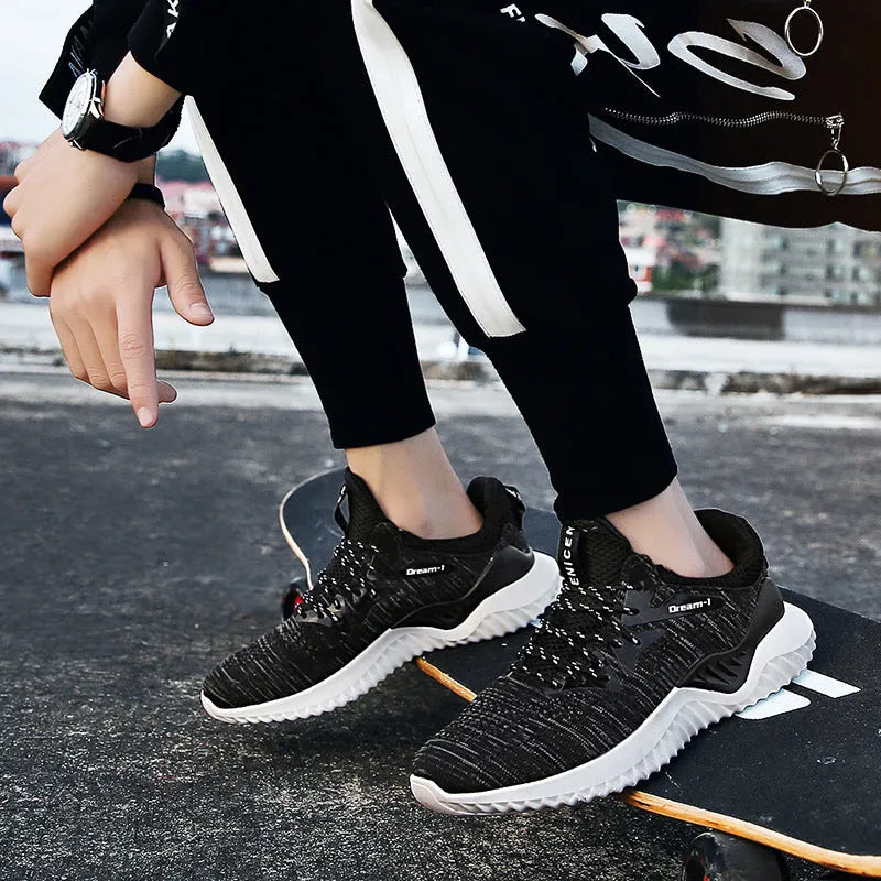 Student running shoes with mesh fabric upper, front strap closure, and low-top design in multiple colour options