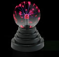 Colourful anti-radiation magic ball light with glass sphere on ABS base and USB cable.
