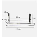 Silver stainless steel paper towel rack hanging on kitchen cabinet door