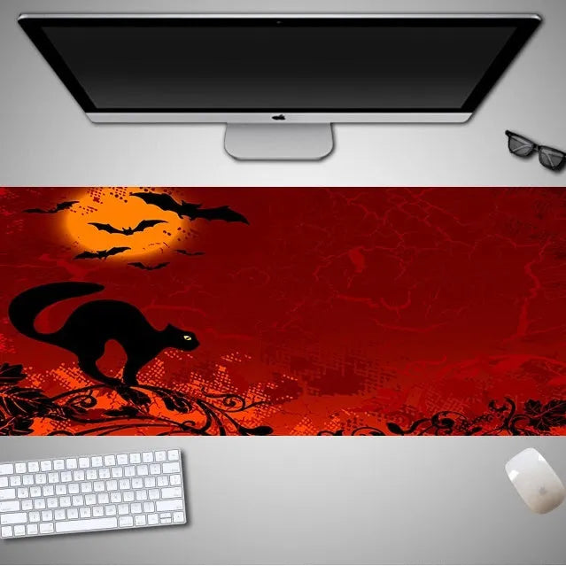 Oversized Halloween-themed mouse pad with non-slip rubber cloth base on a desk