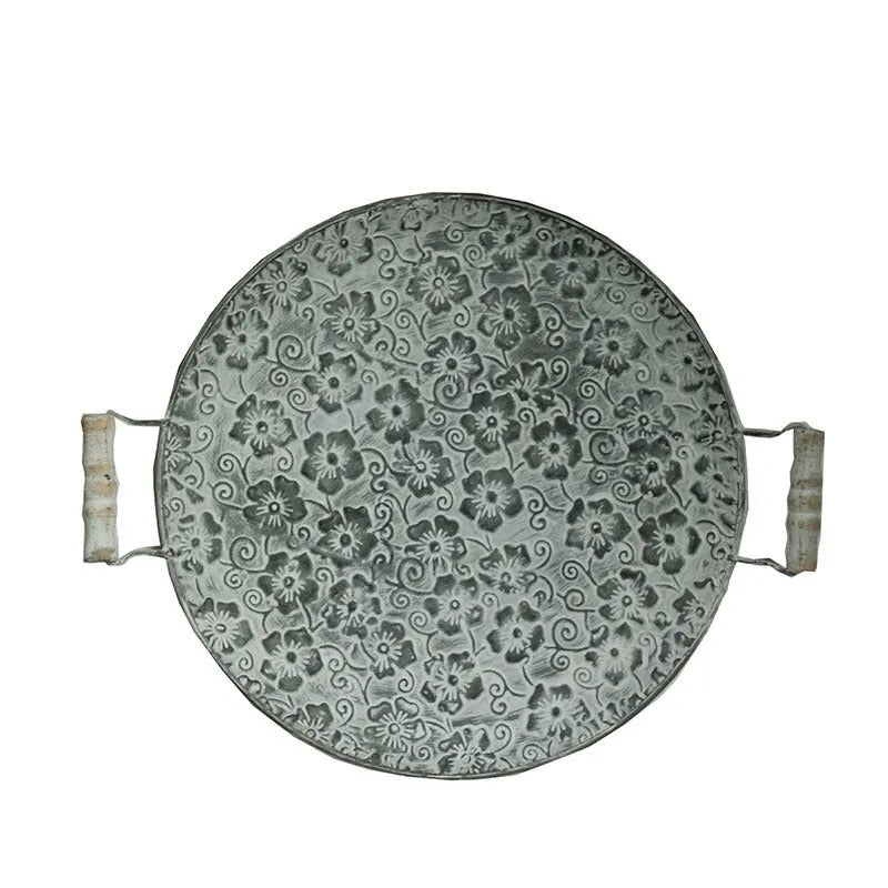 Round wrought iron belt-style storage tray shown in two available sizes.