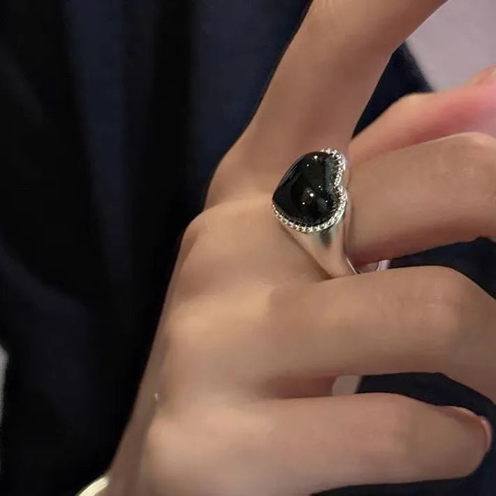 Adjustable sterling silver ring with black agate heart centrepiece