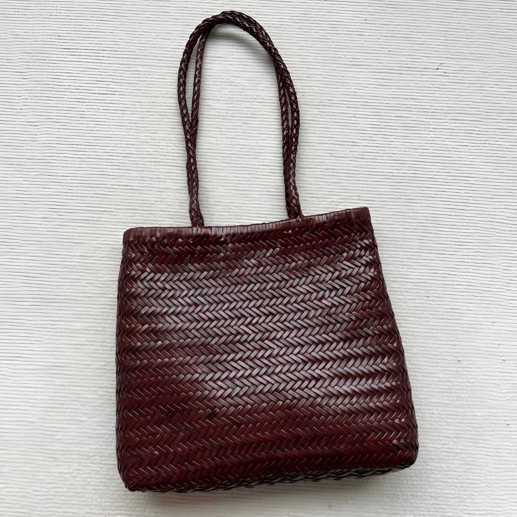Brown handmade woven tote bag with three-dimensional pocket made from cowhide leather
