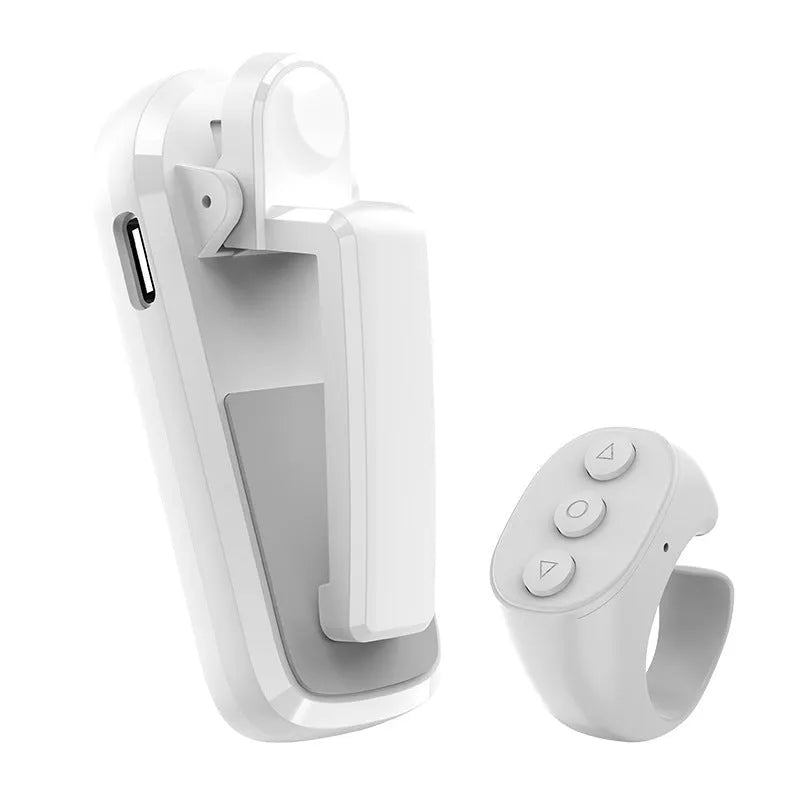 Wireless page turner remote control and foot clicker for tablets on a wooden table.