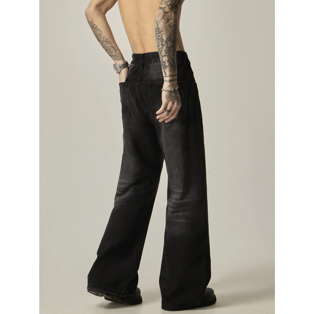 Black retro straight leg jeans with loose fit and zipper fly on hanger