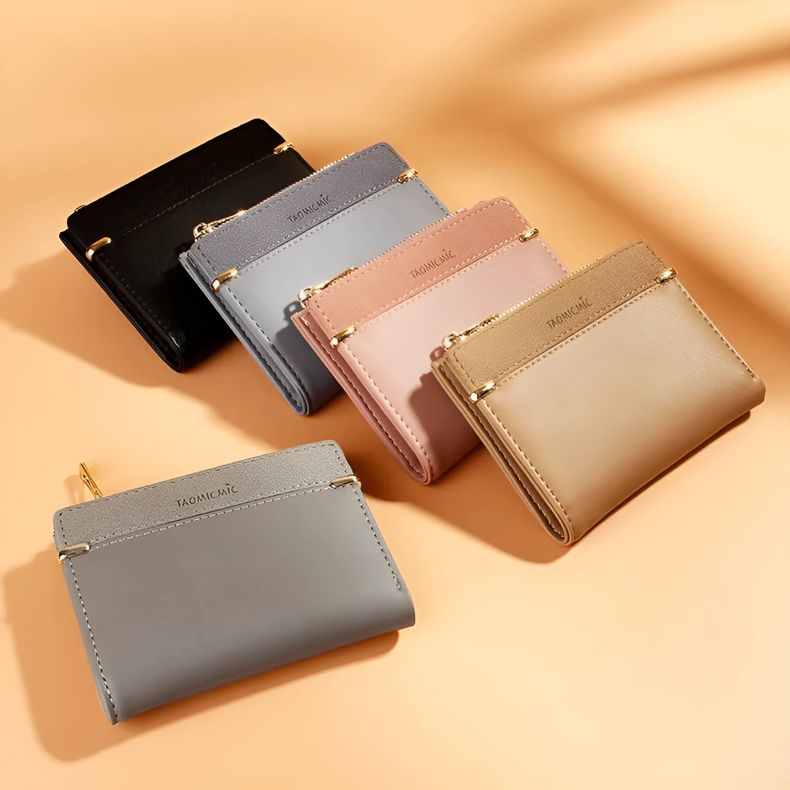 Ladies folded short wallet with zipper closure in PU leather, shown open to reveal multiple card slots and internal compartments.