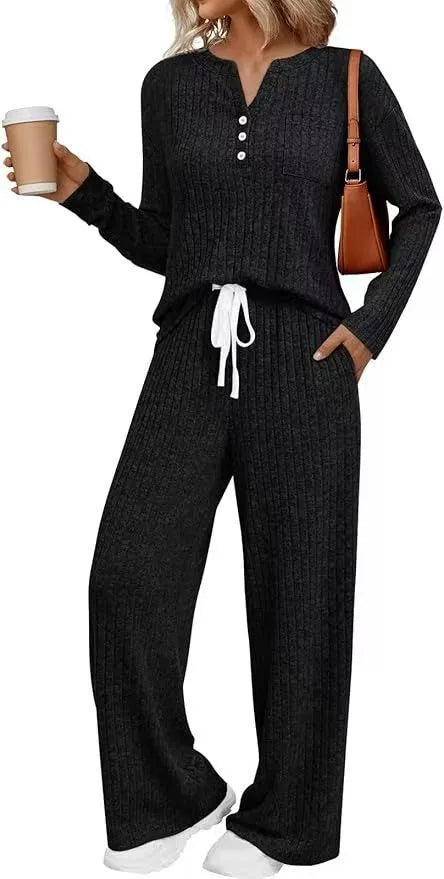 A person wearing a striped, knitted V-neck long coat with lace-up details and pockets in a light grey colour.