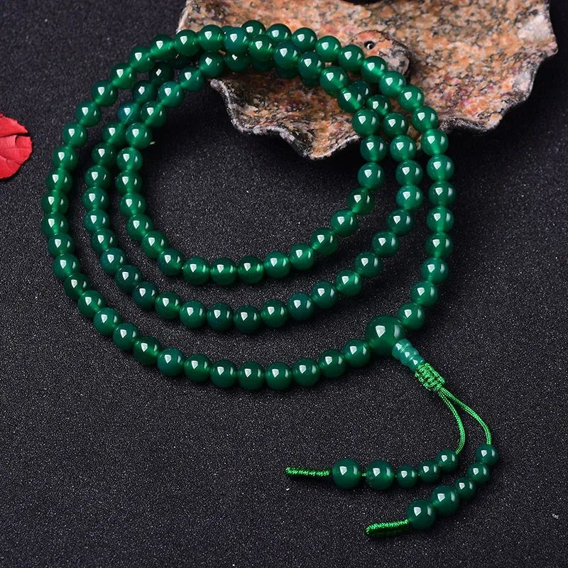 Handmade natural green agate 108 bead bracelet with pendant, showing Buddha beads or Thangka style options.