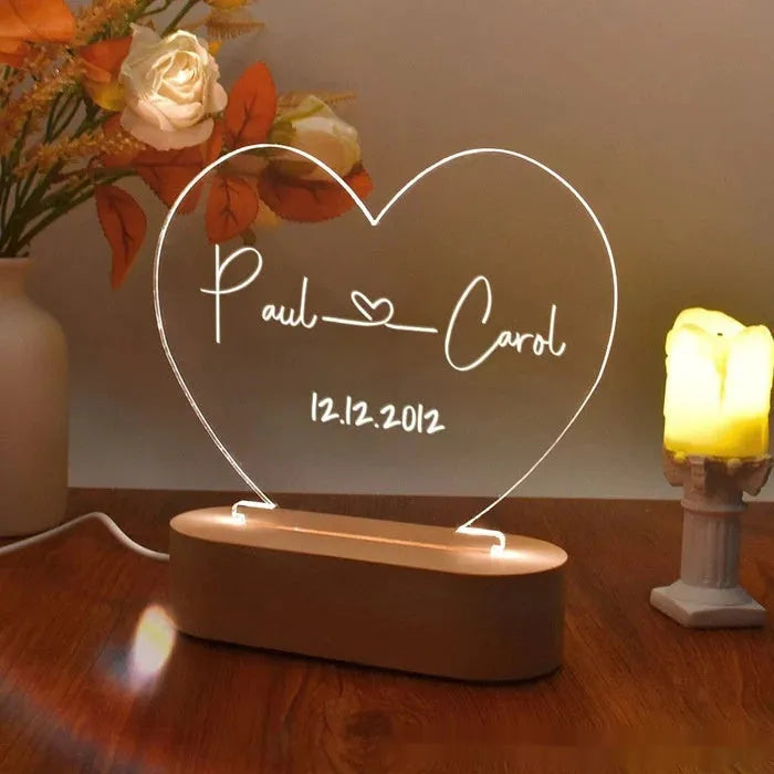Custom acrylic night light with illuminated personalised names and dates for bedroom
