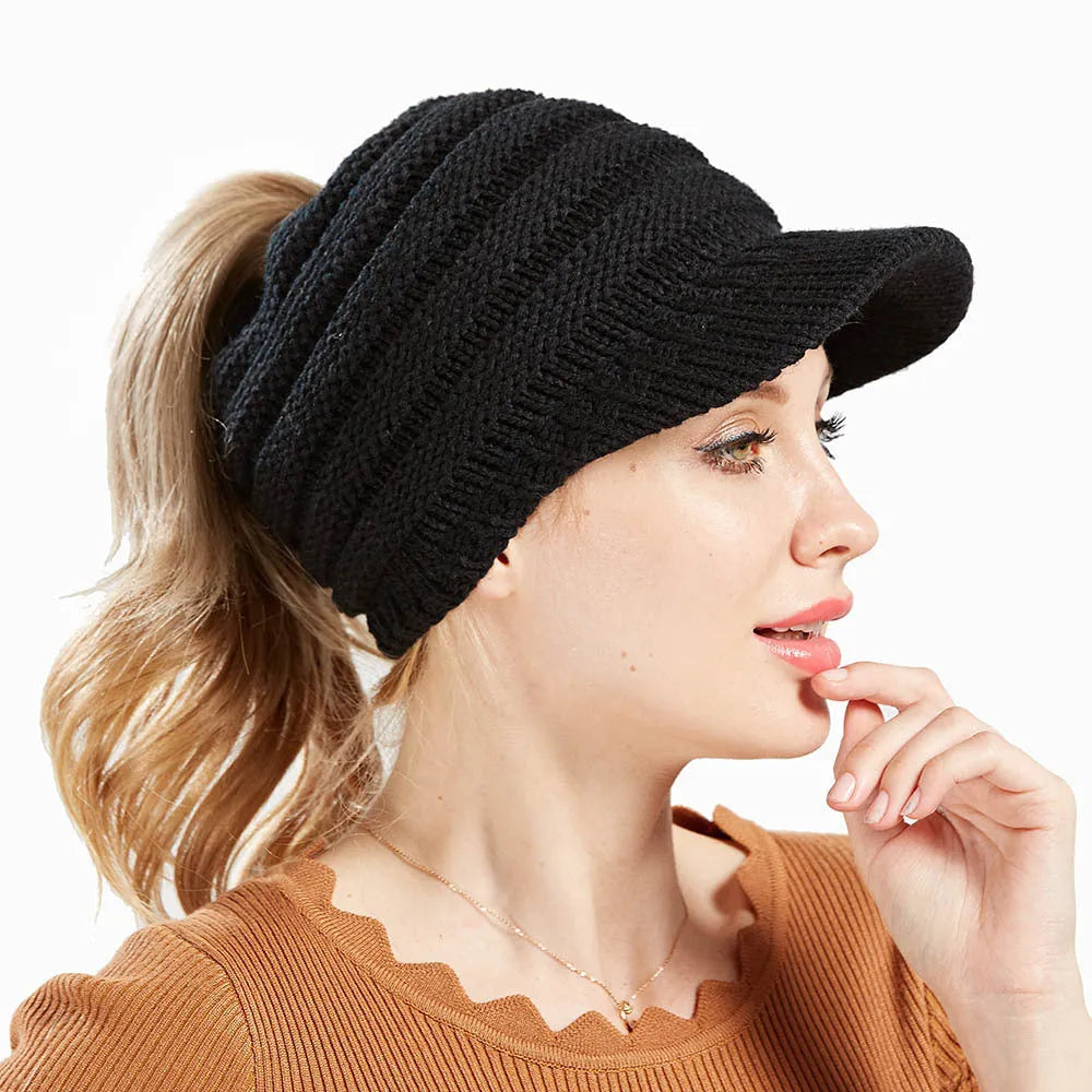 Women's acrylic ponytail beanie with back opening showing hairstyle accommodation