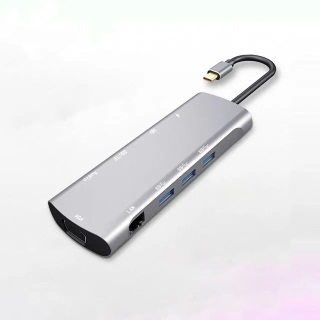 Grey USB-C docking station with HDMI, VGA, and USB ports on aluminium alloy body