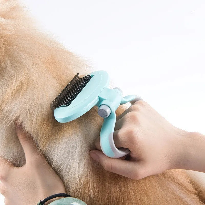 Rotating dual-head dog comb knot remover in blue with steel teeth and TPR handle on white background