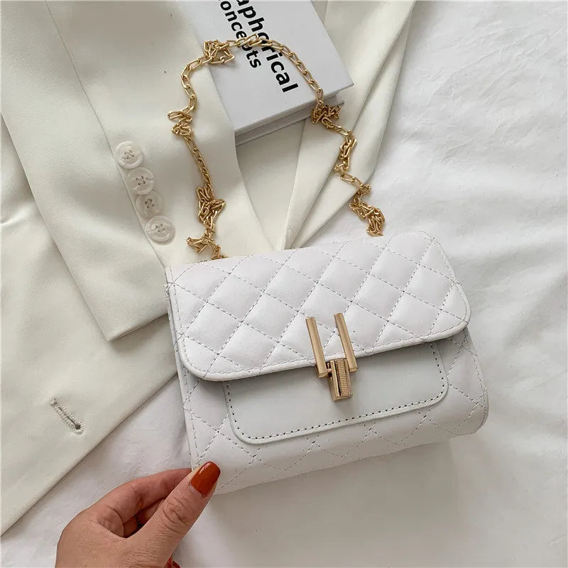 Women's diamond lattice chain crossbody bag in minimalist solid colour design with adjustable strap