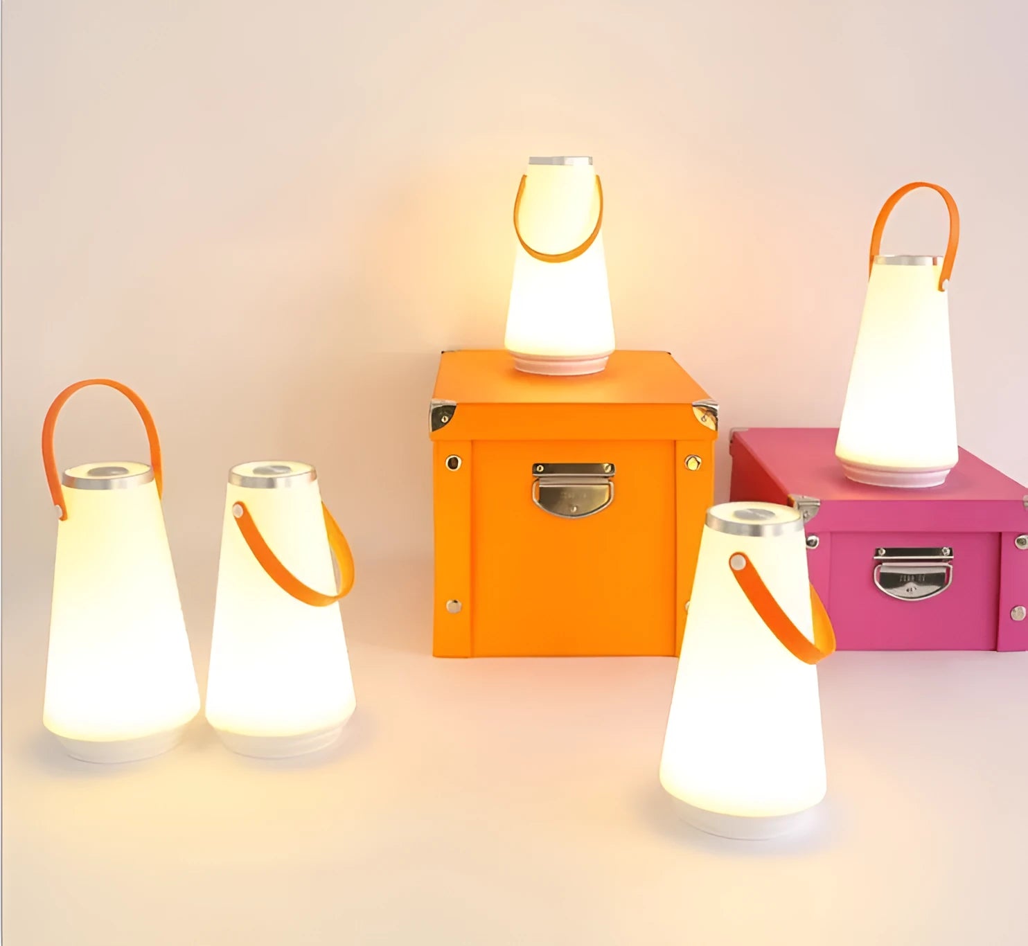 White rechargeable LED lantern night light with USB cable on a table