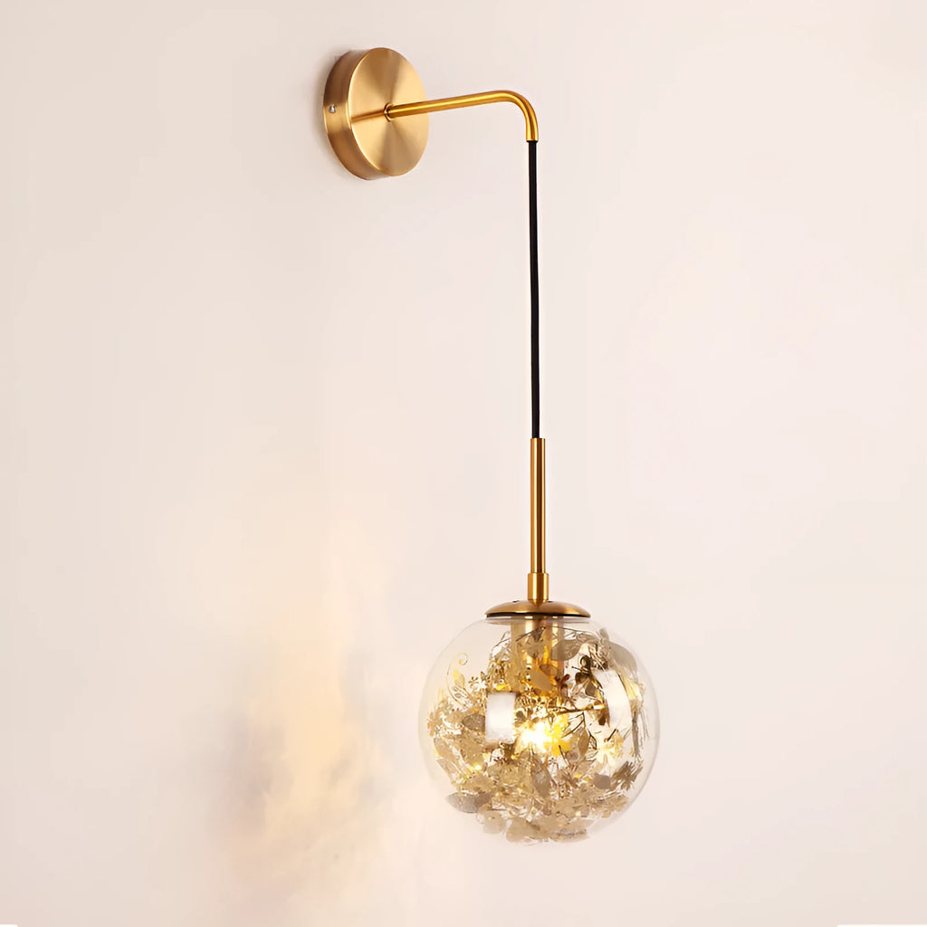 Modern glass wall lamp in golden flower finish mounted beside bed