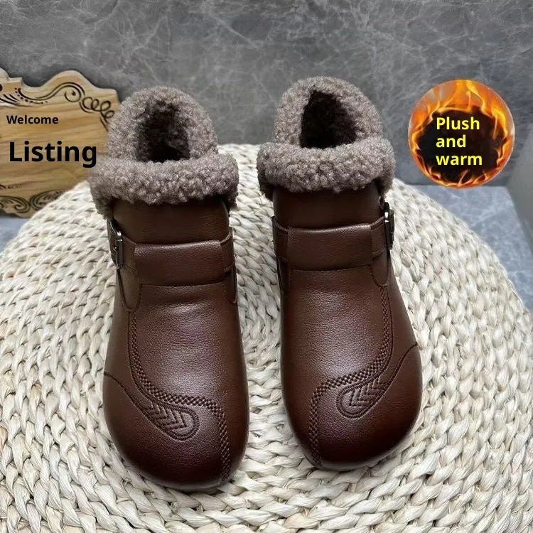 Winter slip-on ankle boots for women in black synthetic leather with low platform heel and round toe