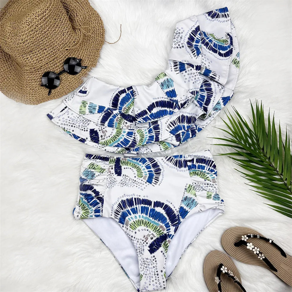 White women's one-shoulder swimsuit with a textured large lotus leaf design and double-layer construction.