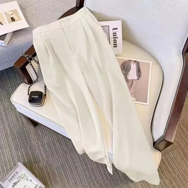 Women's loose-fit polyester blouse in multiple colours with matching trousers for office wear.