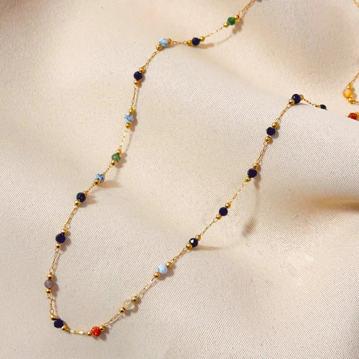 Women's titanium steel necklace with natural stone pendant and gold electroplated finish