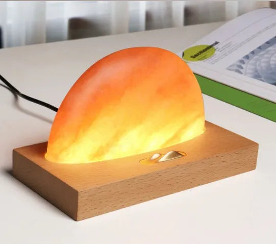 Sunrise Oriental wooden base table lamp with natural crystal salt shade and built-in wireless phone charging.
