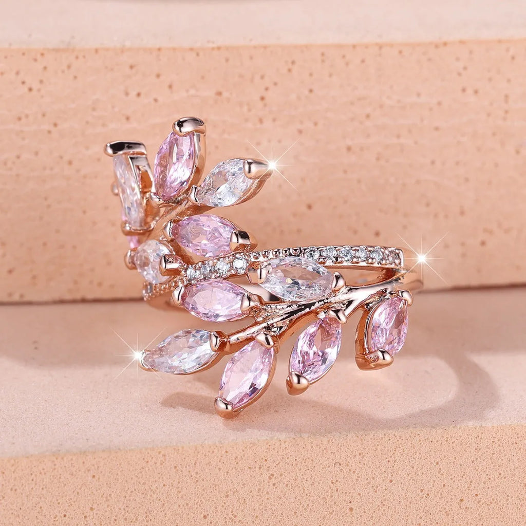 Copper leaf-shaped ring with adjustable band and central horse eye zircon stone in a choice of colours.