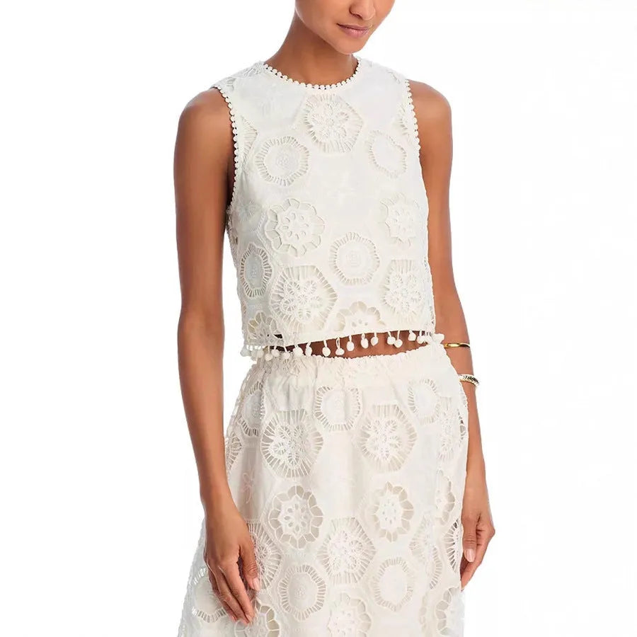White women's sleeveless top and long skirt suit with retro embroidery details