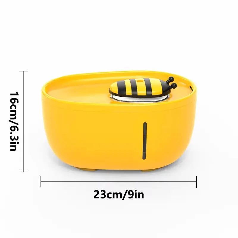Yellow automatic cat water fountain with filter and silent USB pump on anti-slip base.