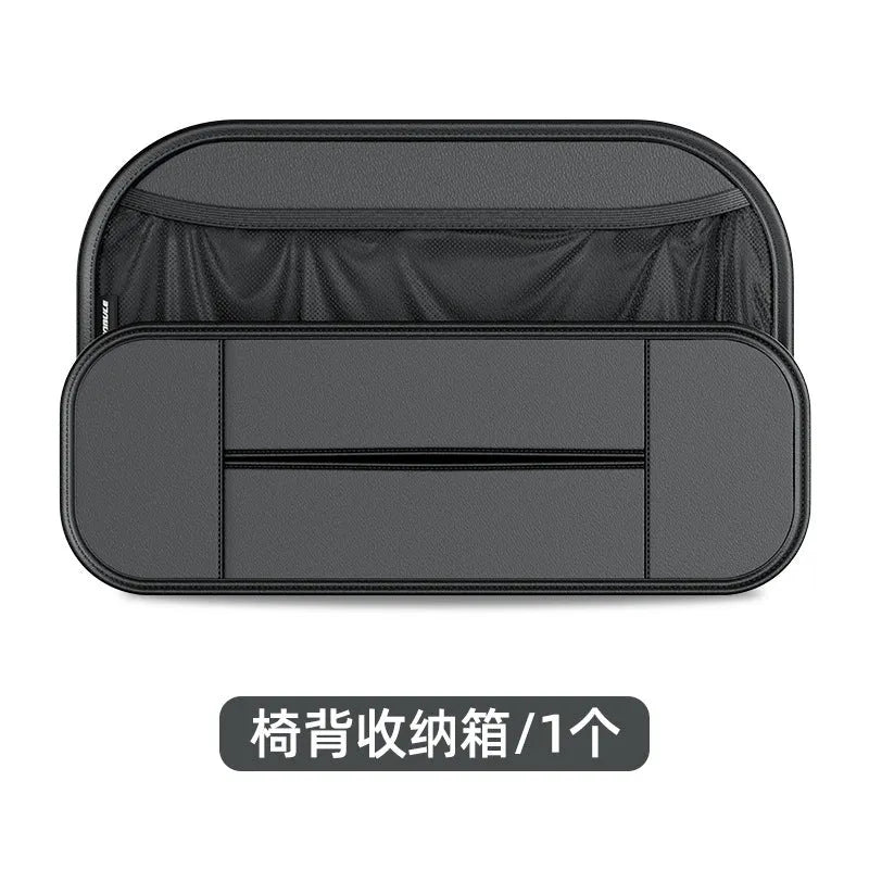 Black leather car seat rear storage bag attached to a vehicle seat, showing its storage box shape.