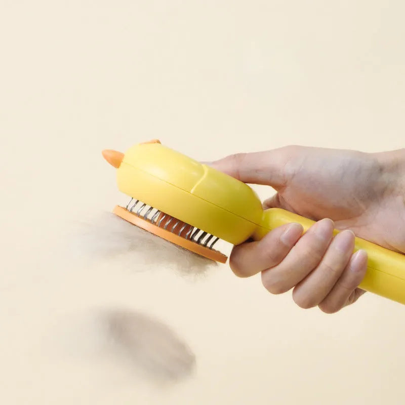 Purple self-cleaning pet grooming brush with stainless steel bristles and a one-button mechanism.
