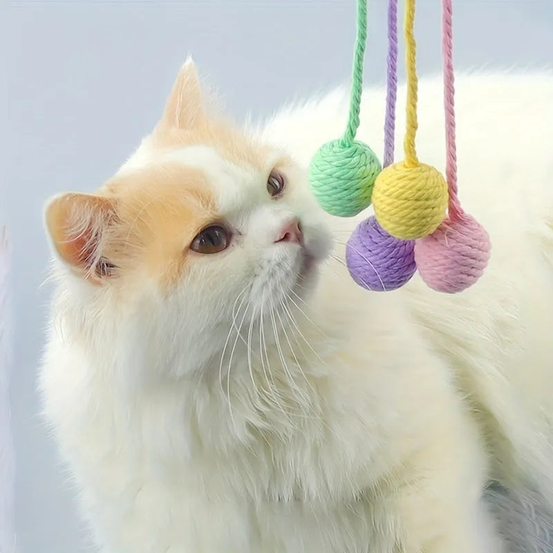 Colourful cat toy ball with rope handle and internal bell in small and medium sizes