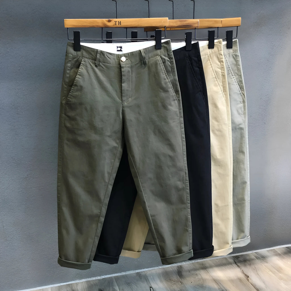 Men's cropped pure cotton casual pants in green, with mid waist and zipper fly.