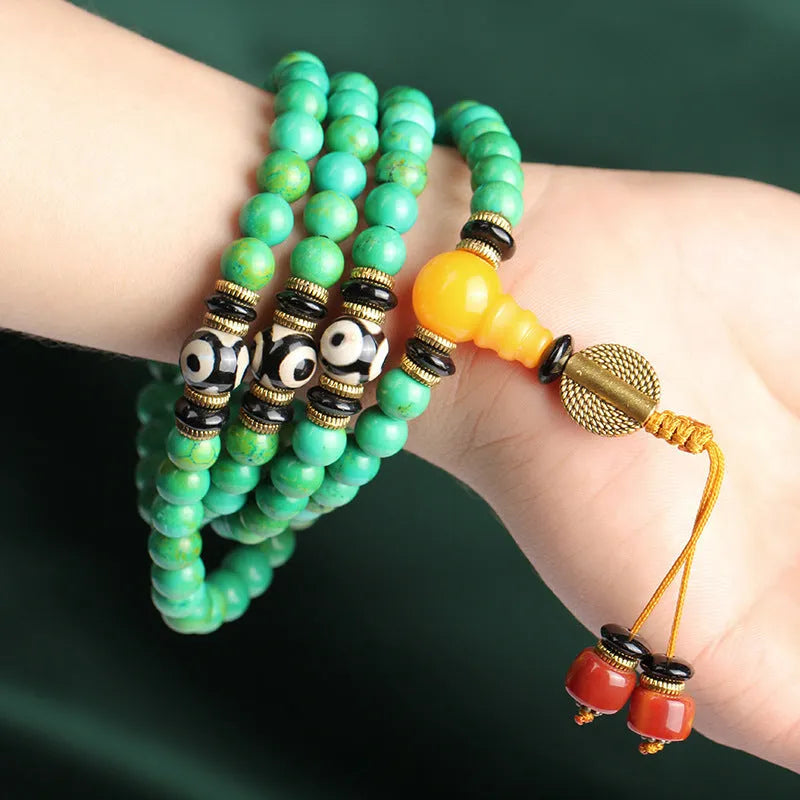 Natural turquoise bracelet with 108 polished 8mm round beads showing raw ore texture