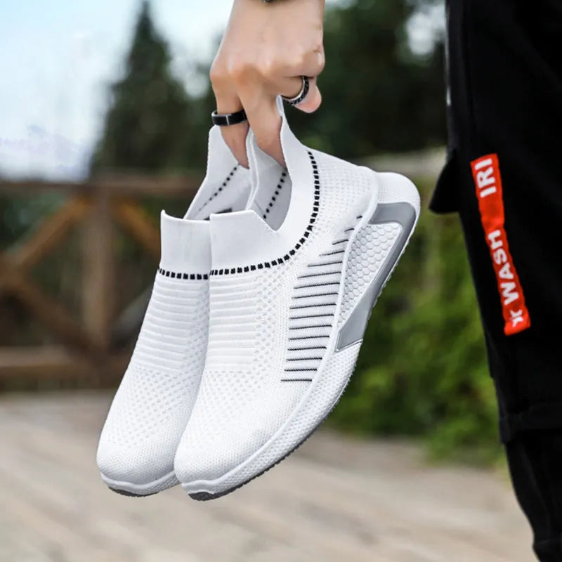 Men's black and white striped mesh sock shoes with Flyknit upper and lace-up front.