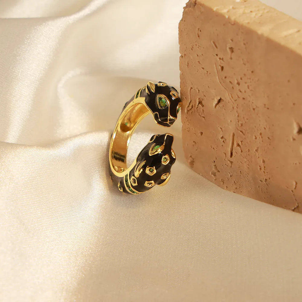 Geometric open ring for women with a black cheetah print pattern, size 7.