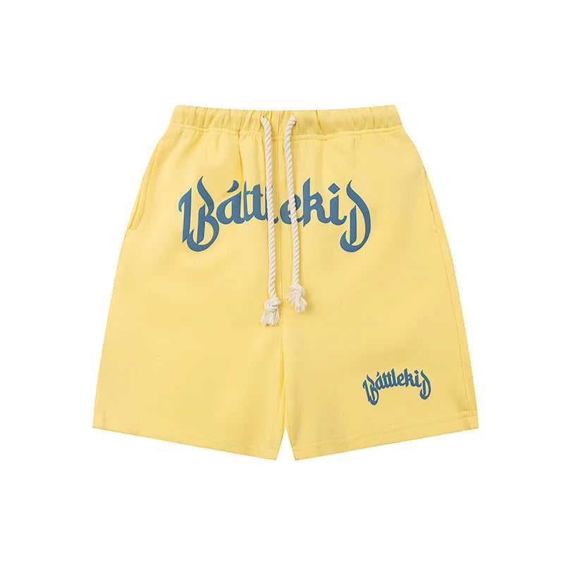 Men's loose cotton blend cropped shorts in grey, shown in a casual setting
